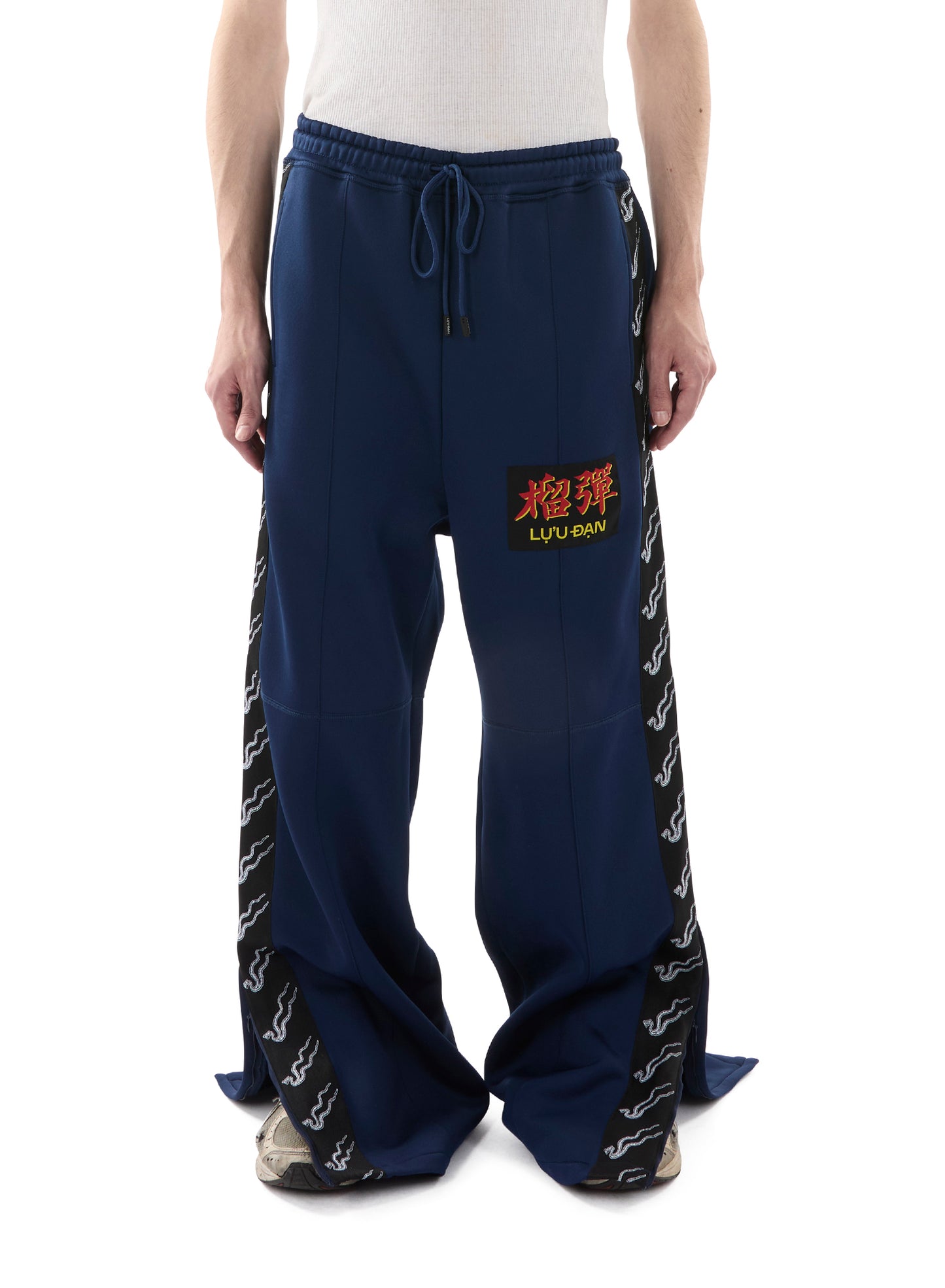 STACKED TRACK PANTS