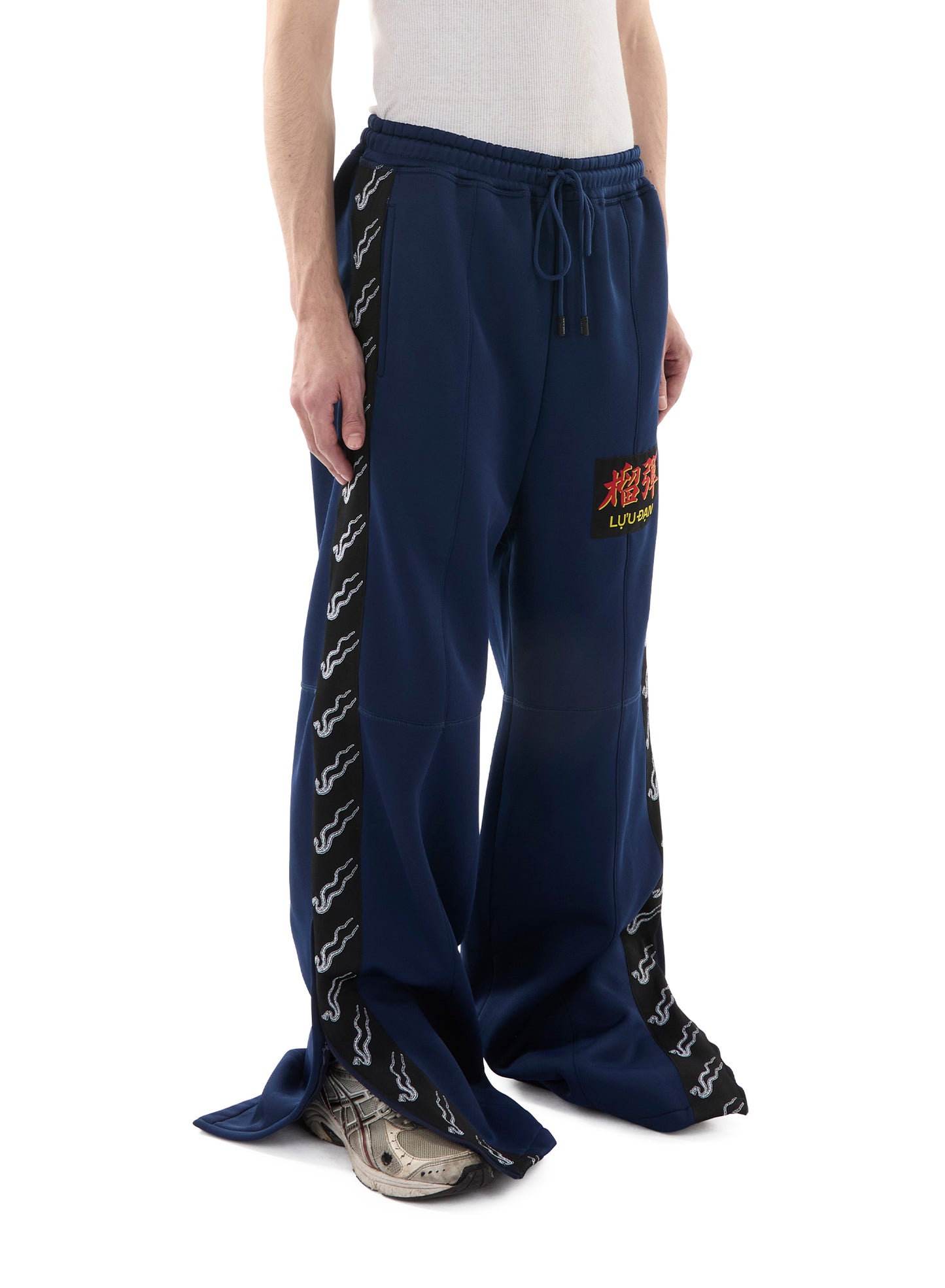 STACKED TRACK PANTS