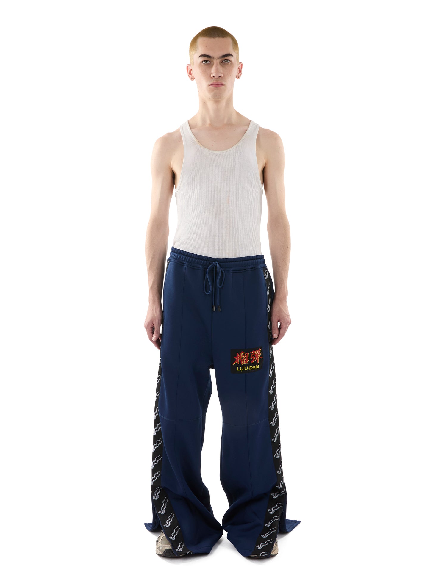 STACKED TRACK PANTS